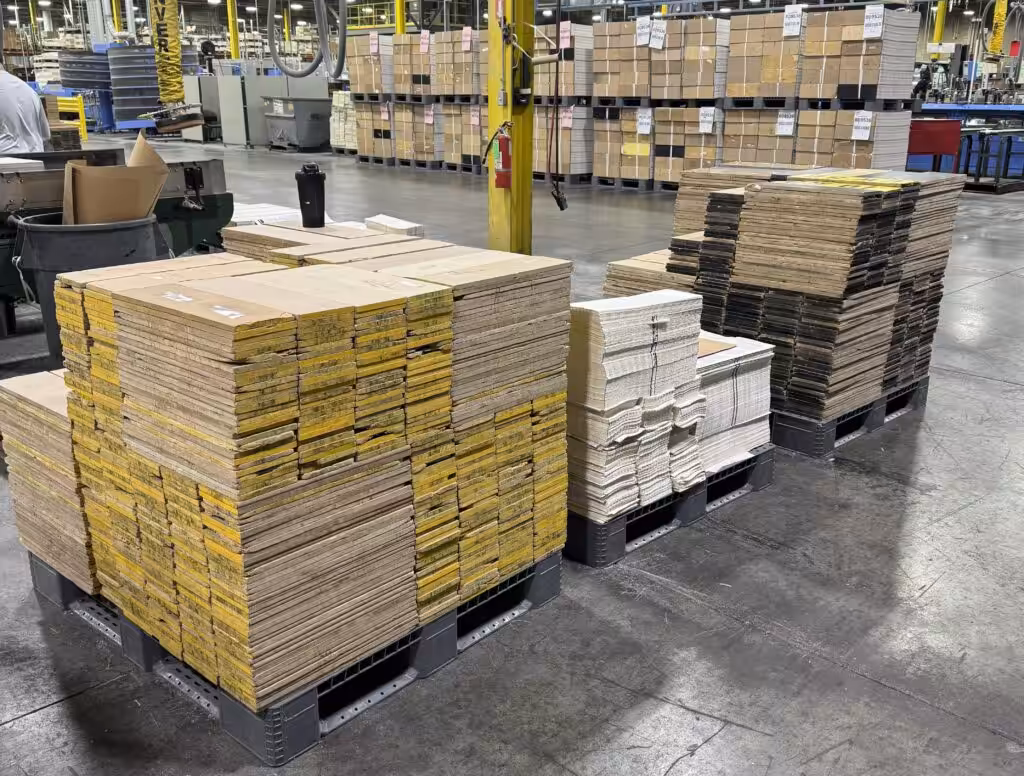 Pallets loaded with product on warehouse floor.