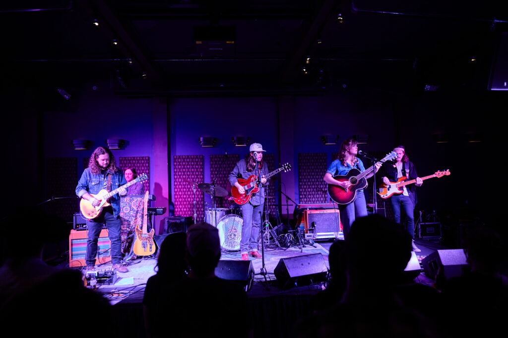 A band performing under lights at the Bright Box in Winchester, VA.