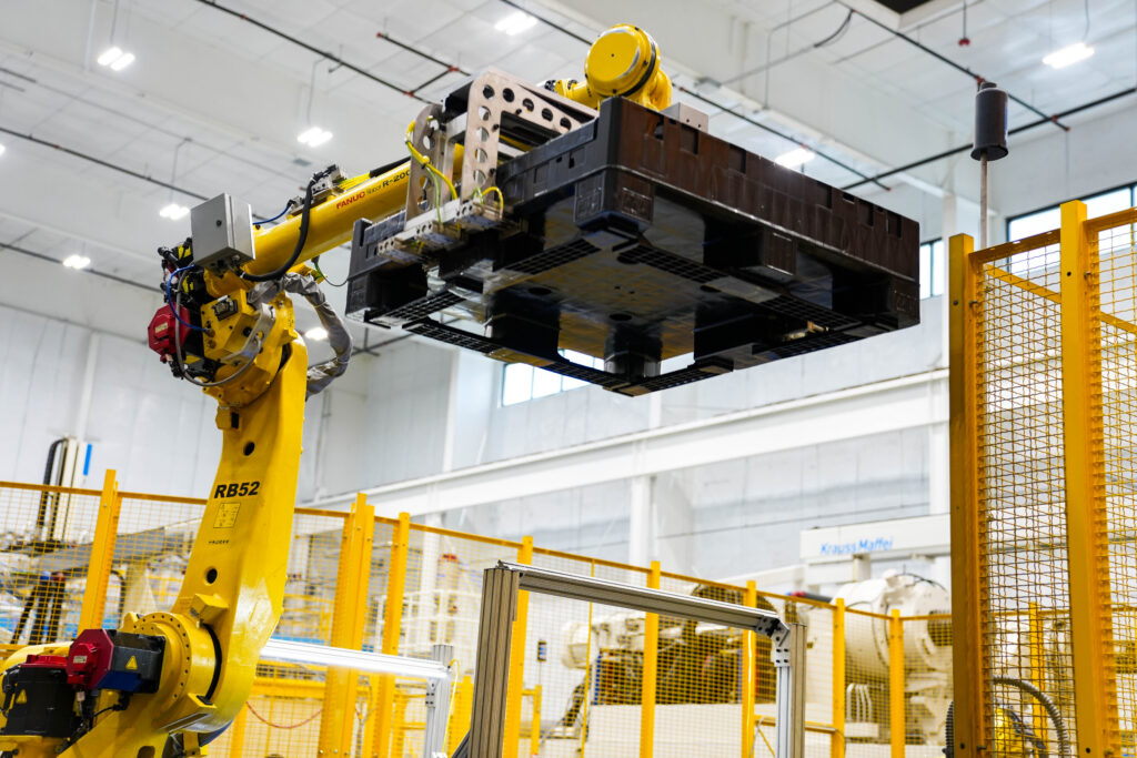 Bulk container being manufactured in an automated cell.