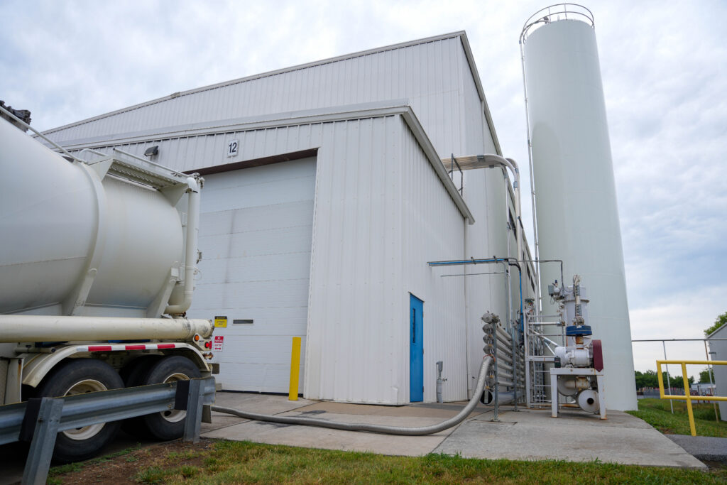 Resin being delivered to silos at a reprocessing facility for reusable packaging.