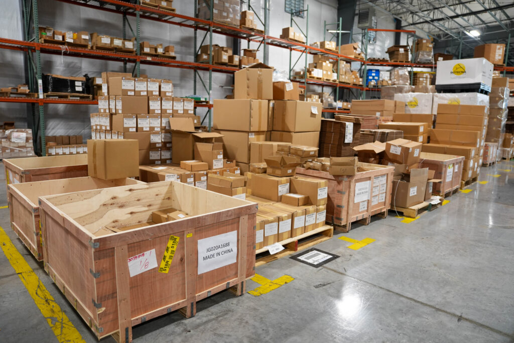 Cardboard boxes taking up space inside warehouse.